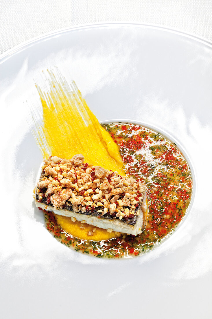 Close-up of breton mackerel with red pepper and fennel puree