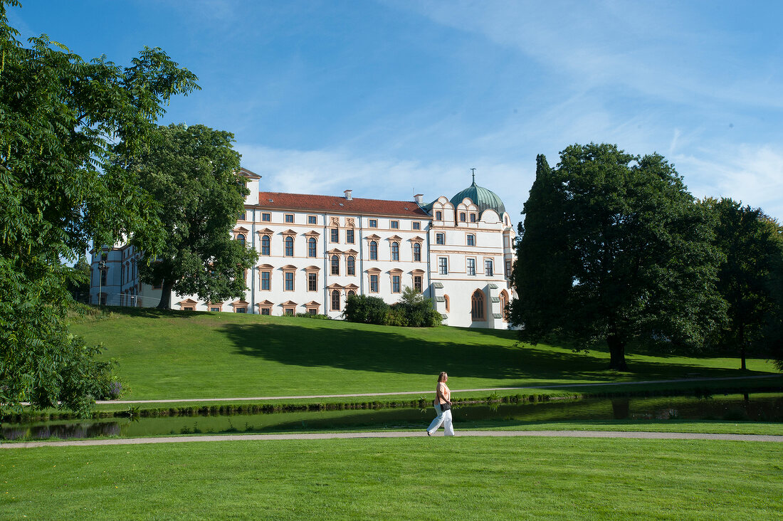 View of Celle Castle with trees and lawn, Lower Saxony, Germany