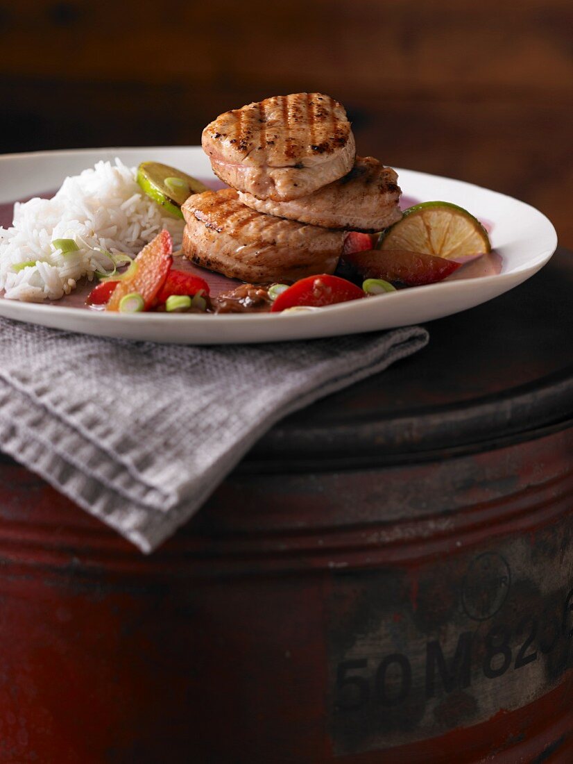 Grilled turkey medallions with a plum and lime sauce