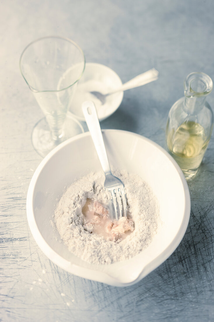 Flour in bowl with fork for preparation of salty dough, step 1