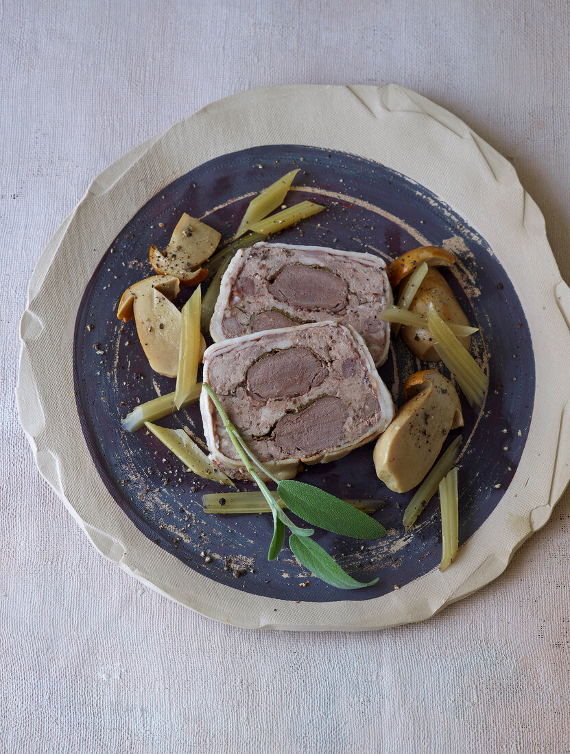 Traditional venison terrine with mushrooms on plate