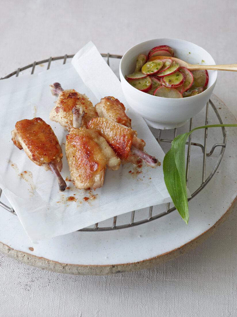 Stuffed chicken wings with salsa on cake rack