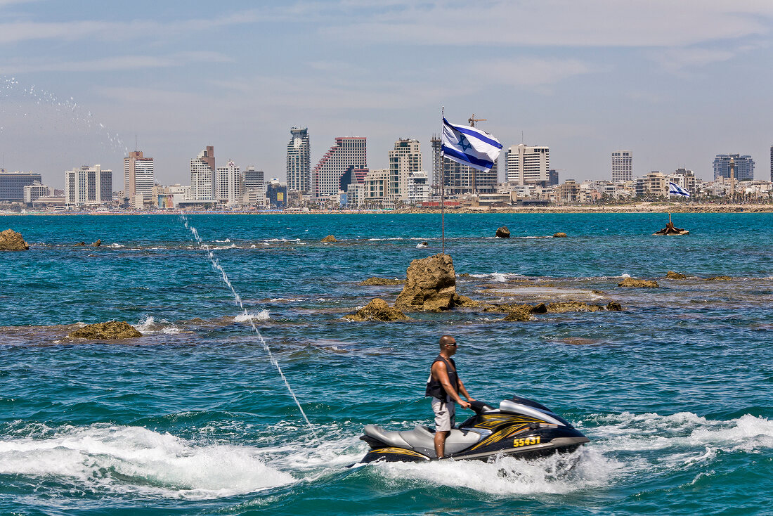 Man riding jet ski in Mediterranean Sea, Tel Aviv, Israel