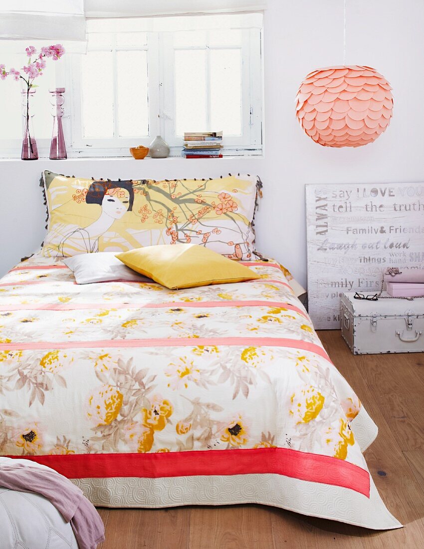 Bed with Japanese pattern on bedspread & pillow