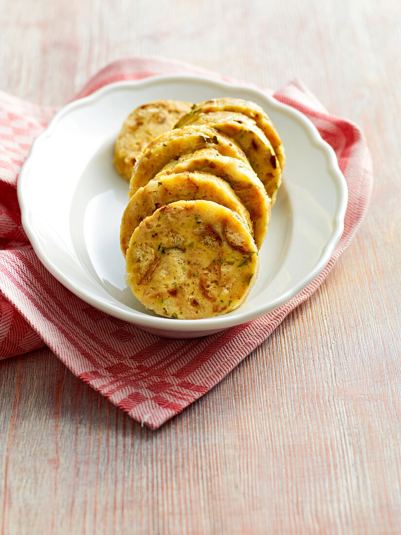 Slices of bread dumplings in bowl, Bavaria, Germany