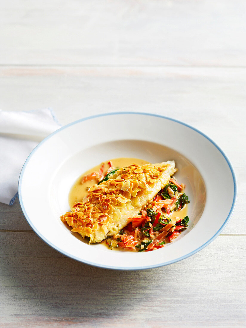 Trout fillets with mangoldgmias in bowl, Bavaria, Germany