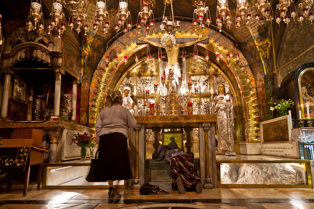 Pilgrim women at Holy Sepulchre in Calvary Chapel, Jerusalem, Israel