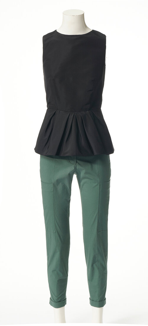 Black top and kaki trousers on mannequin