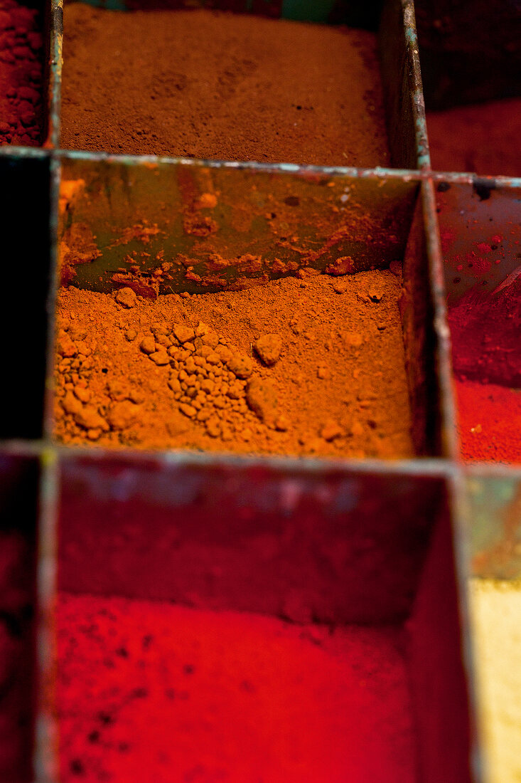 Close-up of red and orange pigments of earth and clay