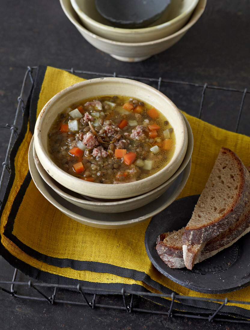 Lentil stew with celery and sausage in bowl