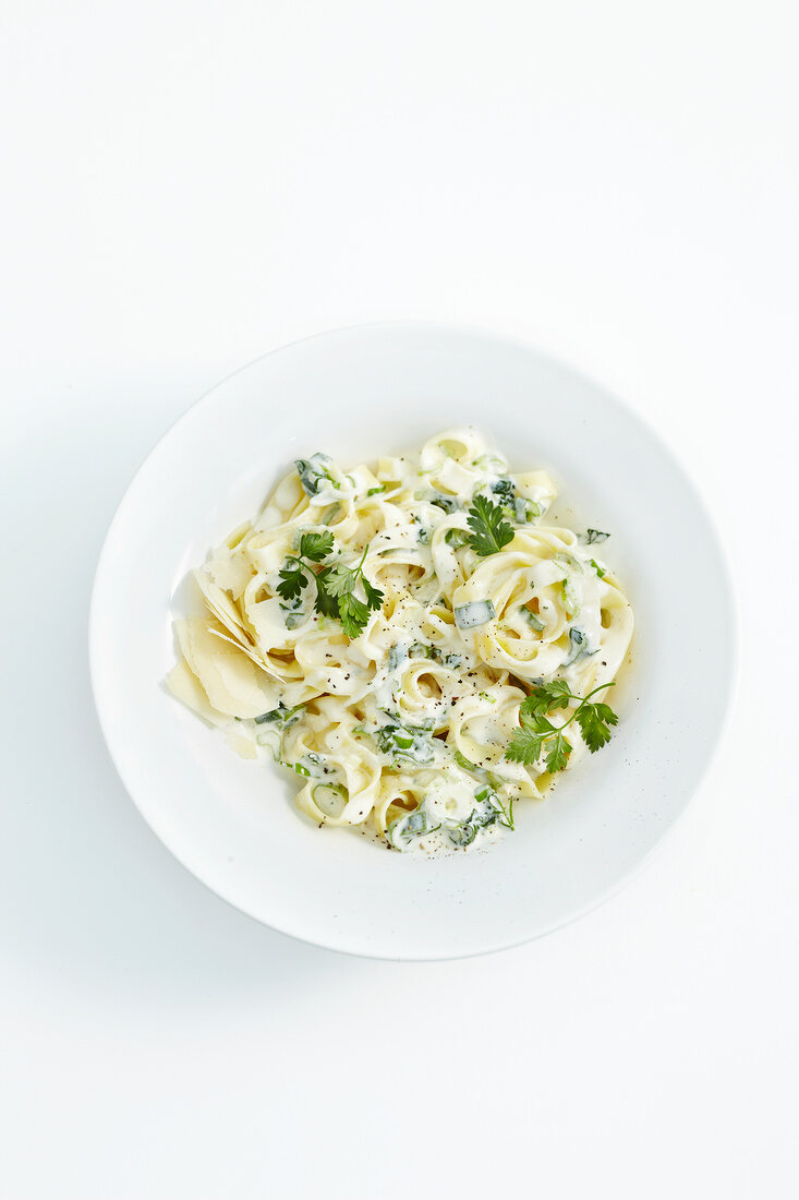 Tagliatelle with chervil and cheese sauce on plate