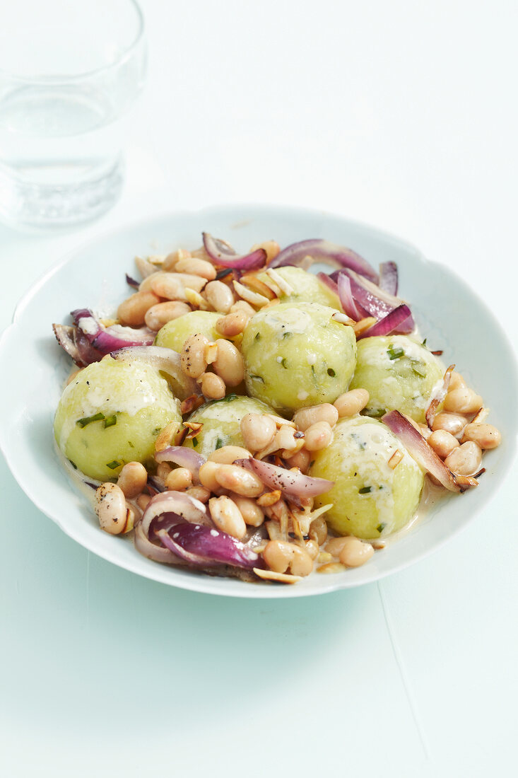 Dumplings with bean ragout on plate