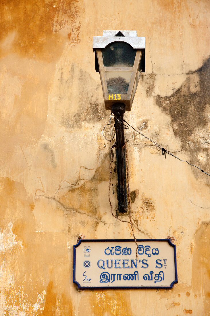 Post lamp on yellow wall, Galle Fort, Sri Lanka