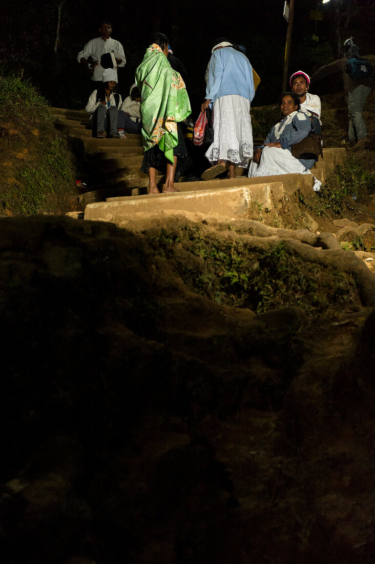 Pilgrims climbing steps at night on Sri Pada mountain, Sri Lanka