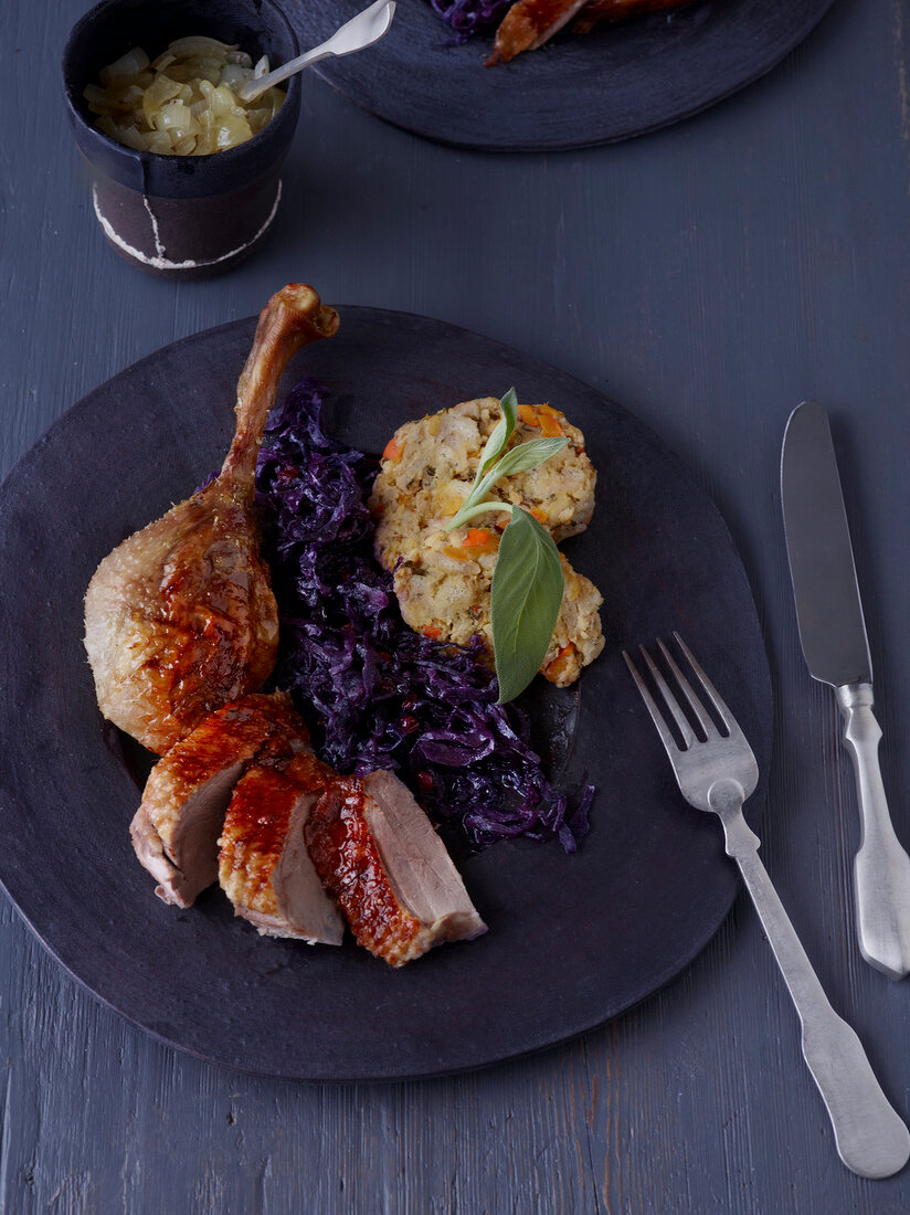 Roast goose with pumpkin dumpling filling in serving dish