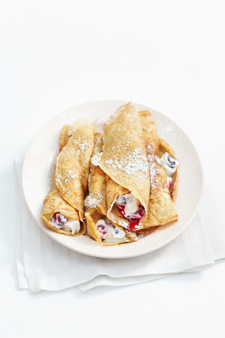 Stuffed espresso crepes on plate