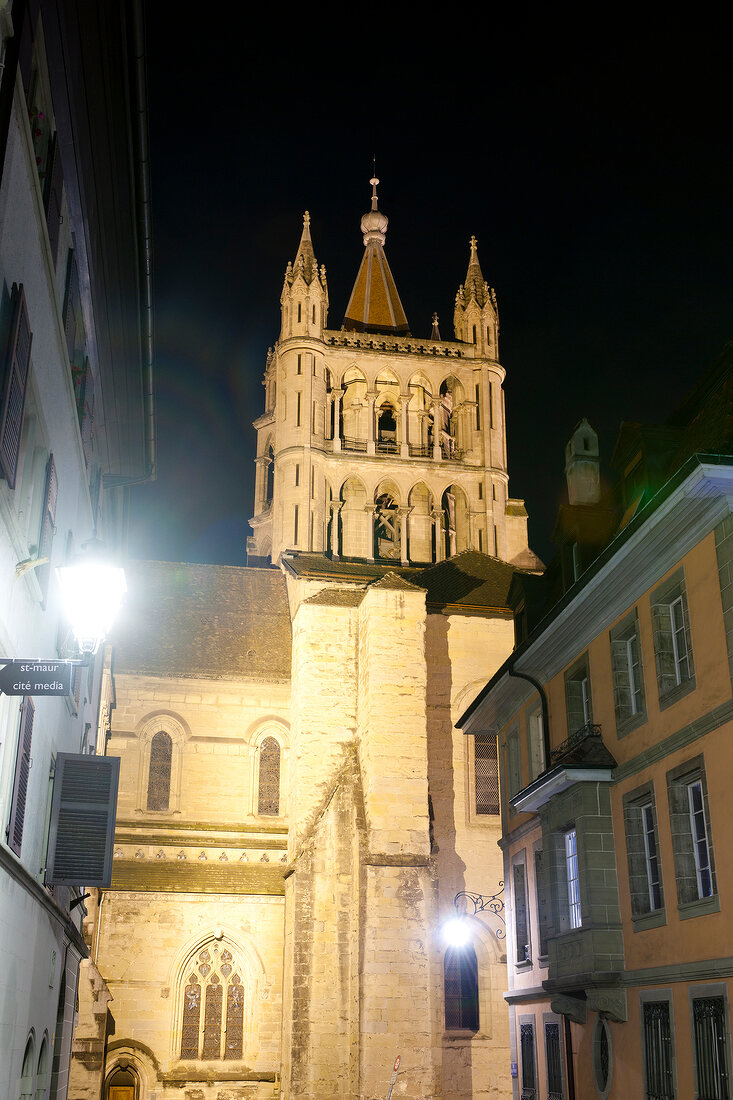 View of houses and Notre-Dame Cathedral at evening in Lausanne, Switzerland