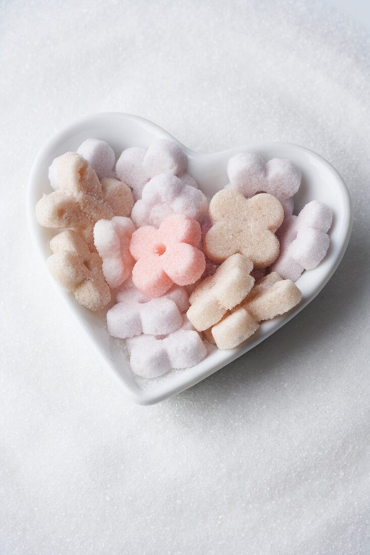 Flowers made from sugar in porcelain heart dish