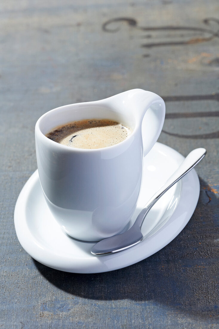 Close-up of espresso cup with spoon