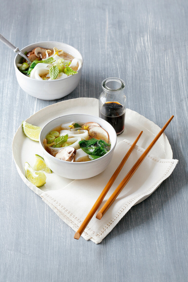 Vietnamese noodle soup with chopstick on serving dish