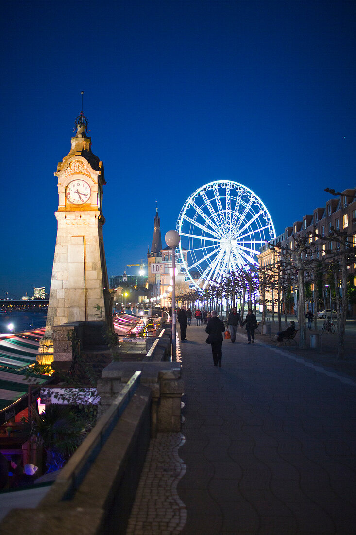 View of illuminated Pegeluhr Ferris wheel, Rhine promenade, Dusseldorf, Bellevue, US