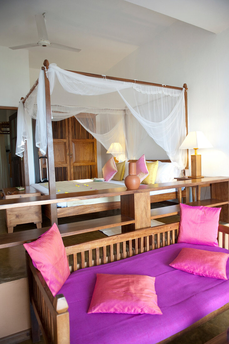 Bedroom with four poster bed in Barberyn Reef Ayurveda Resort, Weligama, Sri Lanka