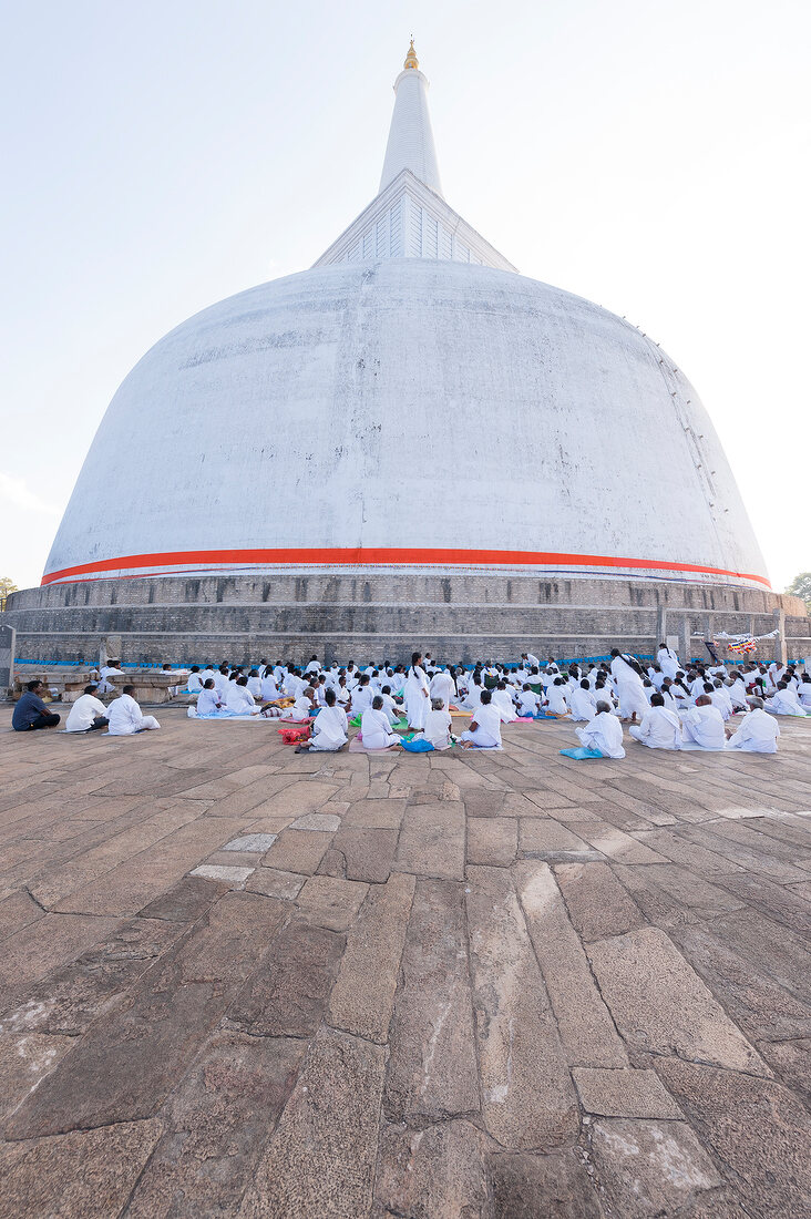 People praying at temple square Stupa of Mirisawetiya, Anuradhapura, Sri Lanka