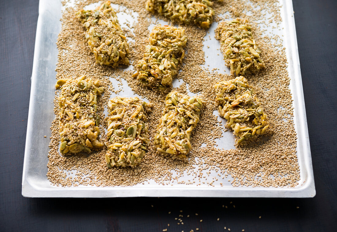 Close-up of pumpkin bars with sesame on tray