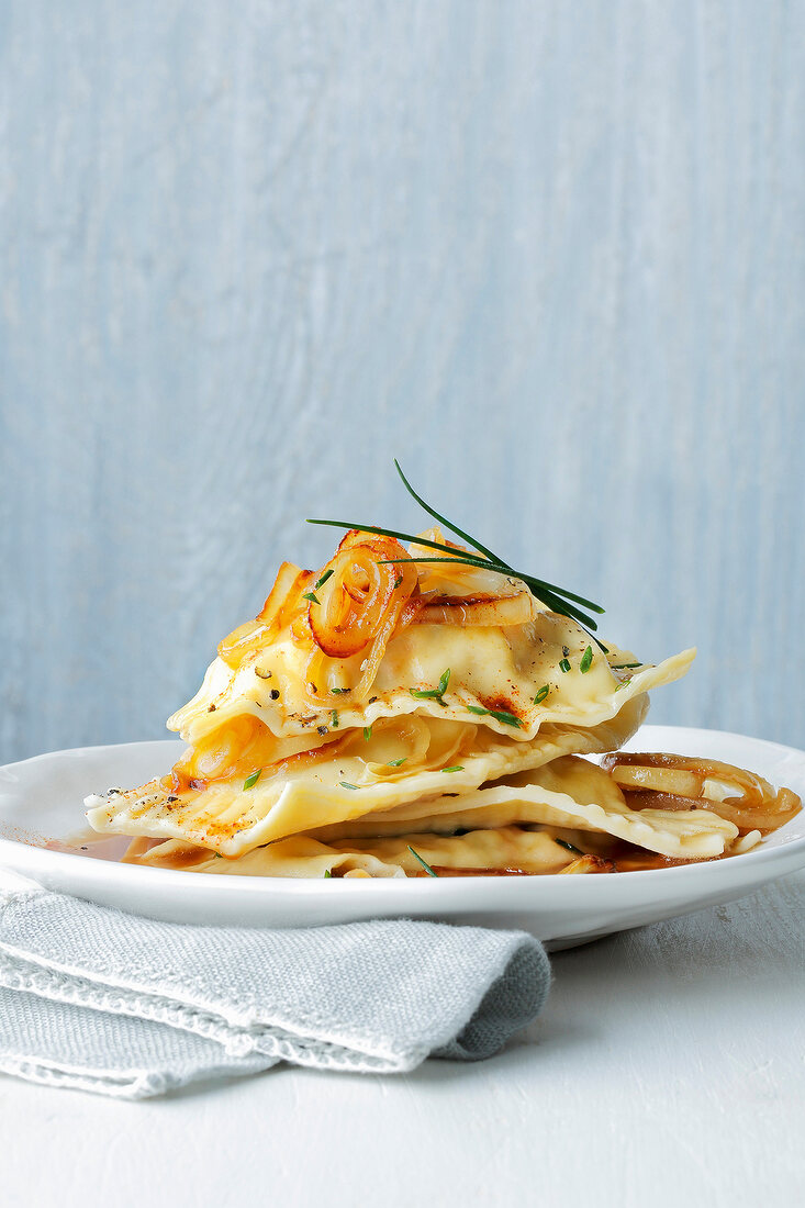 Stack of geschmalzte ravioli on plate