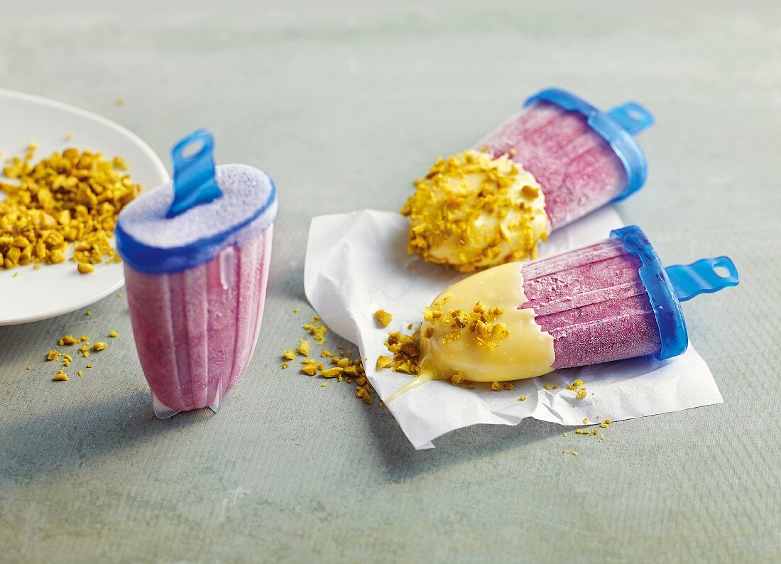 Homemade blueberry and pistachio ice lollies