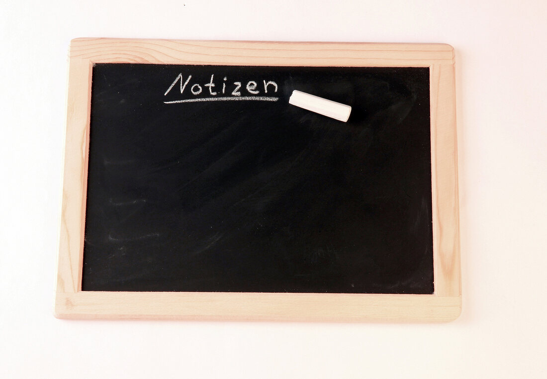 Slate blackboard with note written on it by chalk