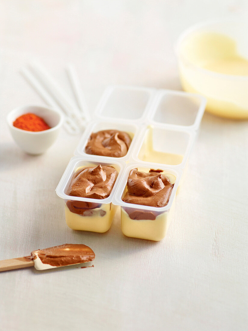 Chocolate on passion fruit ice cream in molding tray