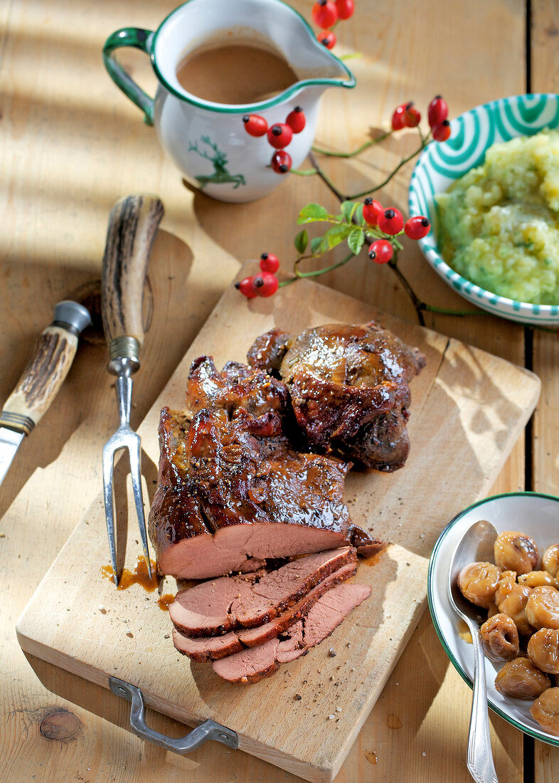 Roast haunch of venison with mashed savoy cabbage and boiled chestnuts