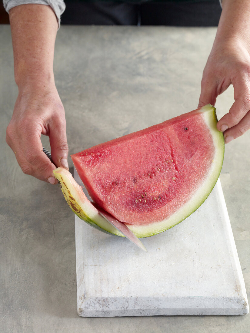 Close-up of peeling watermelon for preparation of jam