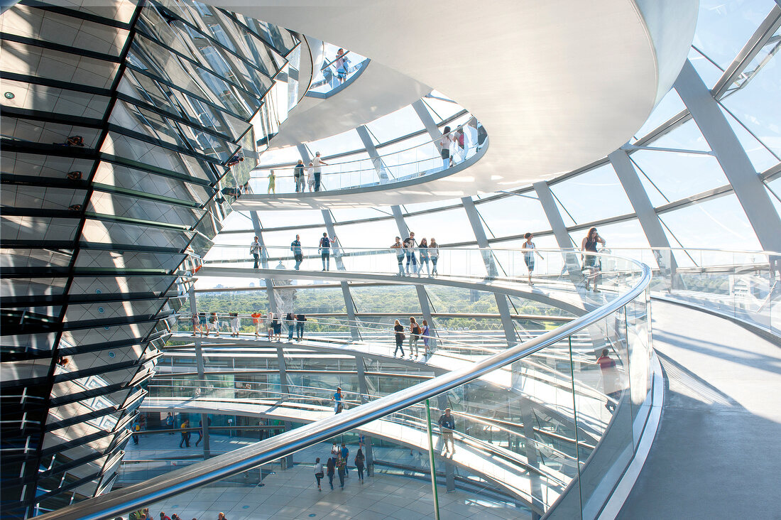 Tourist under glass dome in Reichstag building at Berlin, Germany