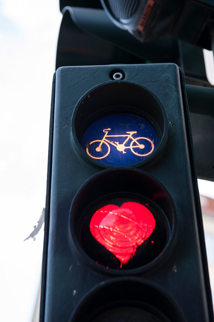 Close-up of traffic lights with heart and cycle symbol in Berlin, Germany