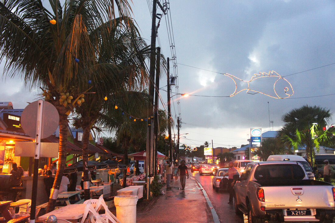 View of shops and vehicles on street at Lesser Antilles, Caribbean island, Barbados