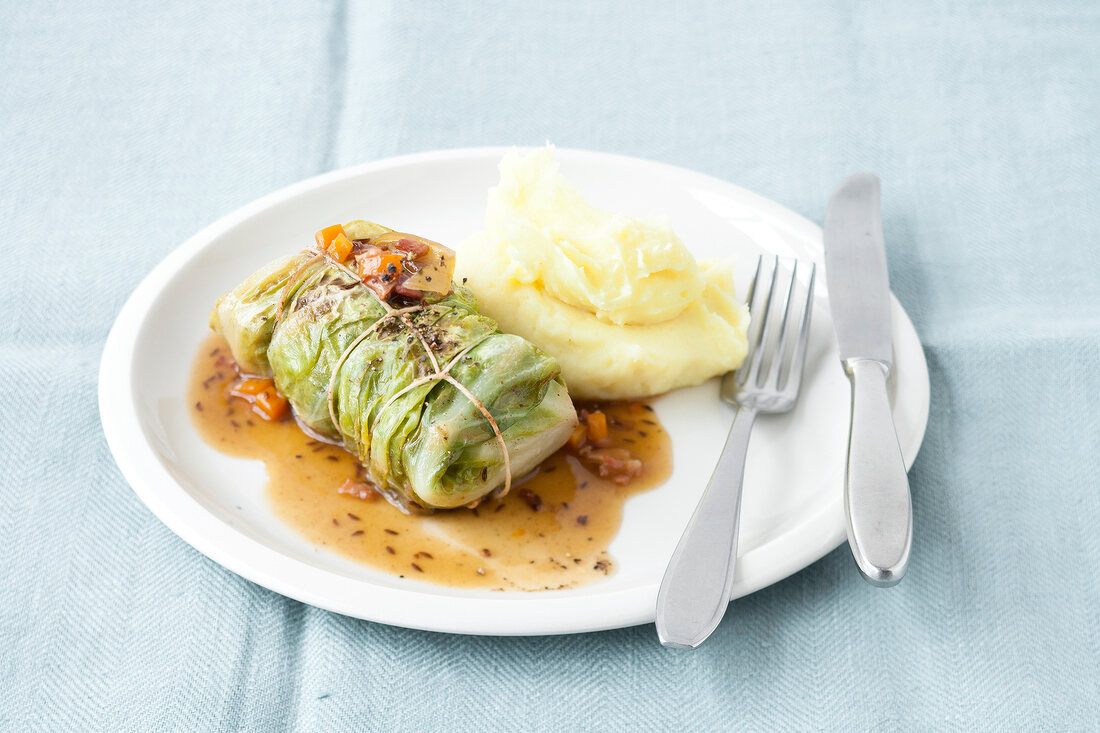 Cabbage rolls with mince meat filling on plate