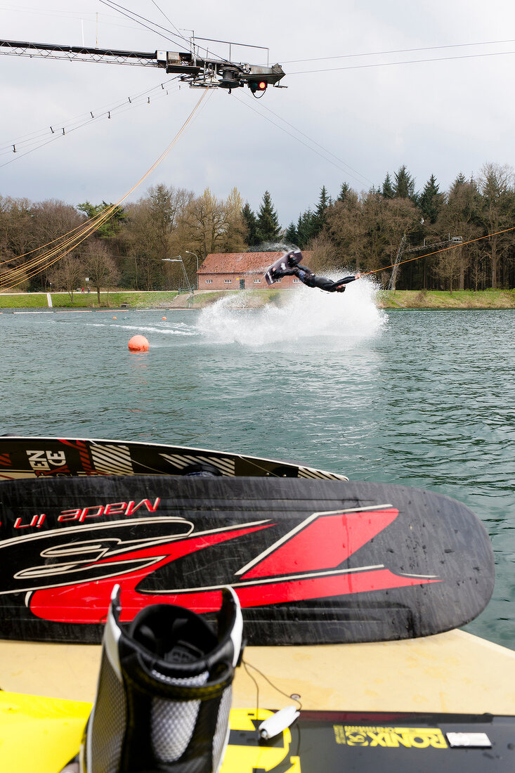 Man water skiing in lake, Dankern Castle, Haren, Germany