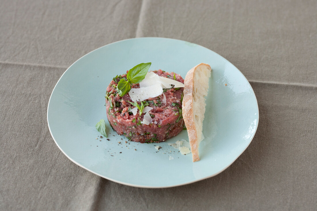 Mediterranean steak tartar on blue plate