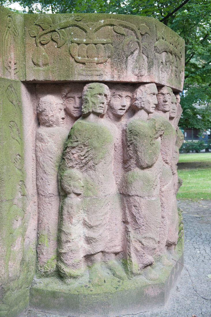Memorial block of woman with moss by Ingeborg Hunzinger in Berlin, Germany