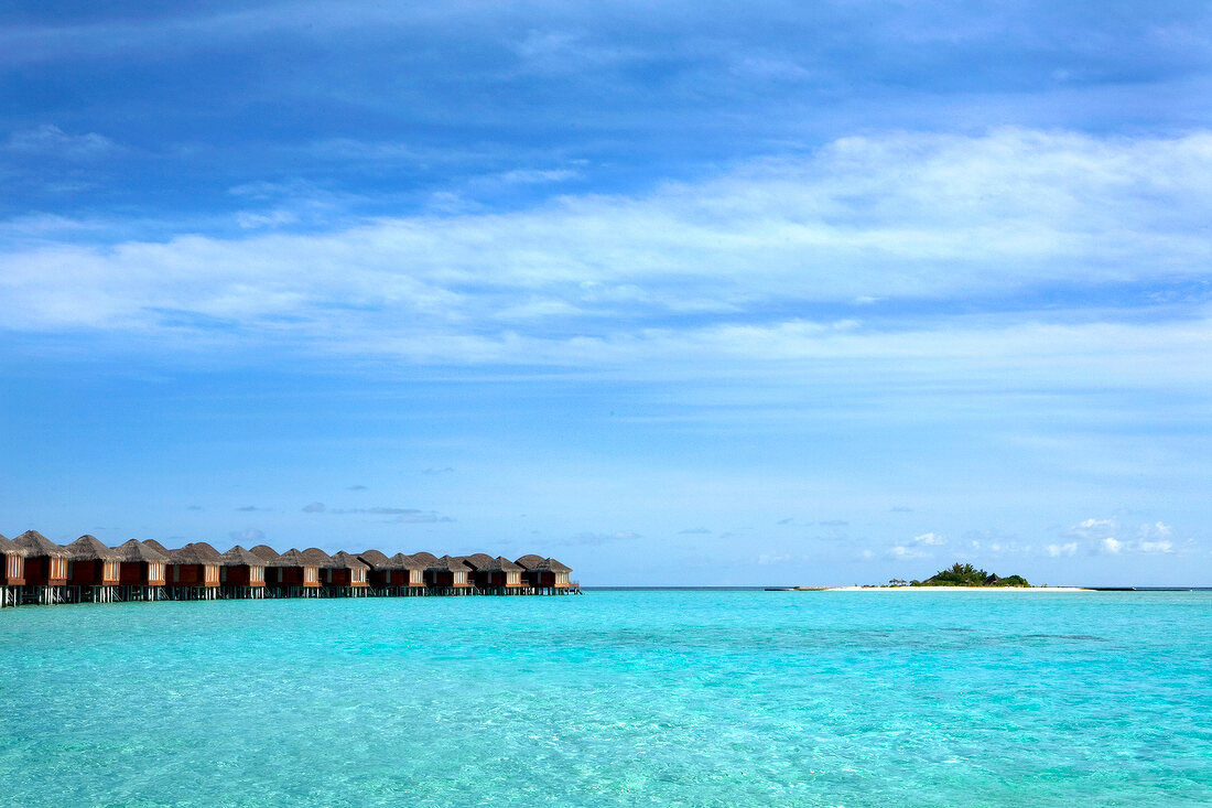 Dhigufinolhu bungalows in water at dock in Maldives island