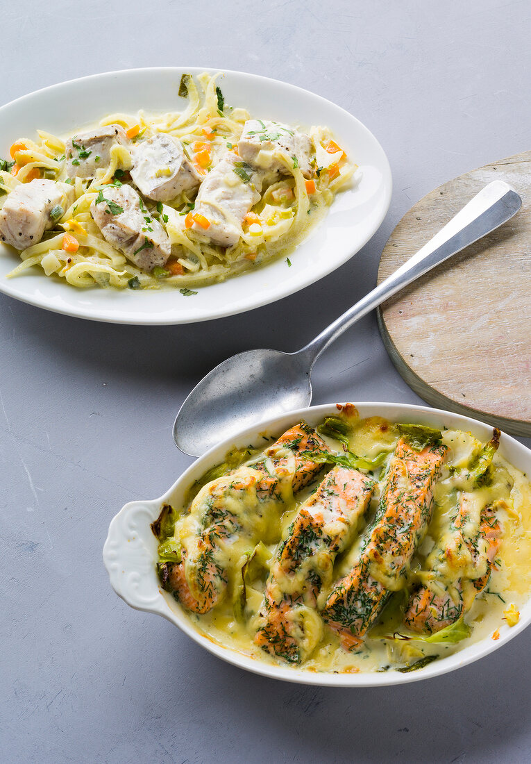 Fennel pollock in serving dish and salmon cabbage in casserole
