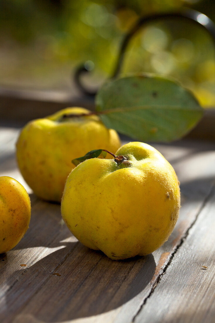 Close-up of quince on wood