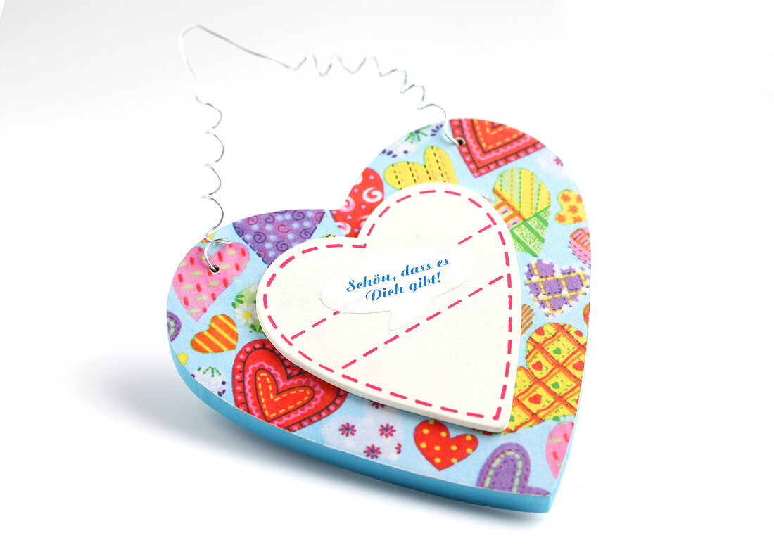 Colourful heart with heart motif on white background