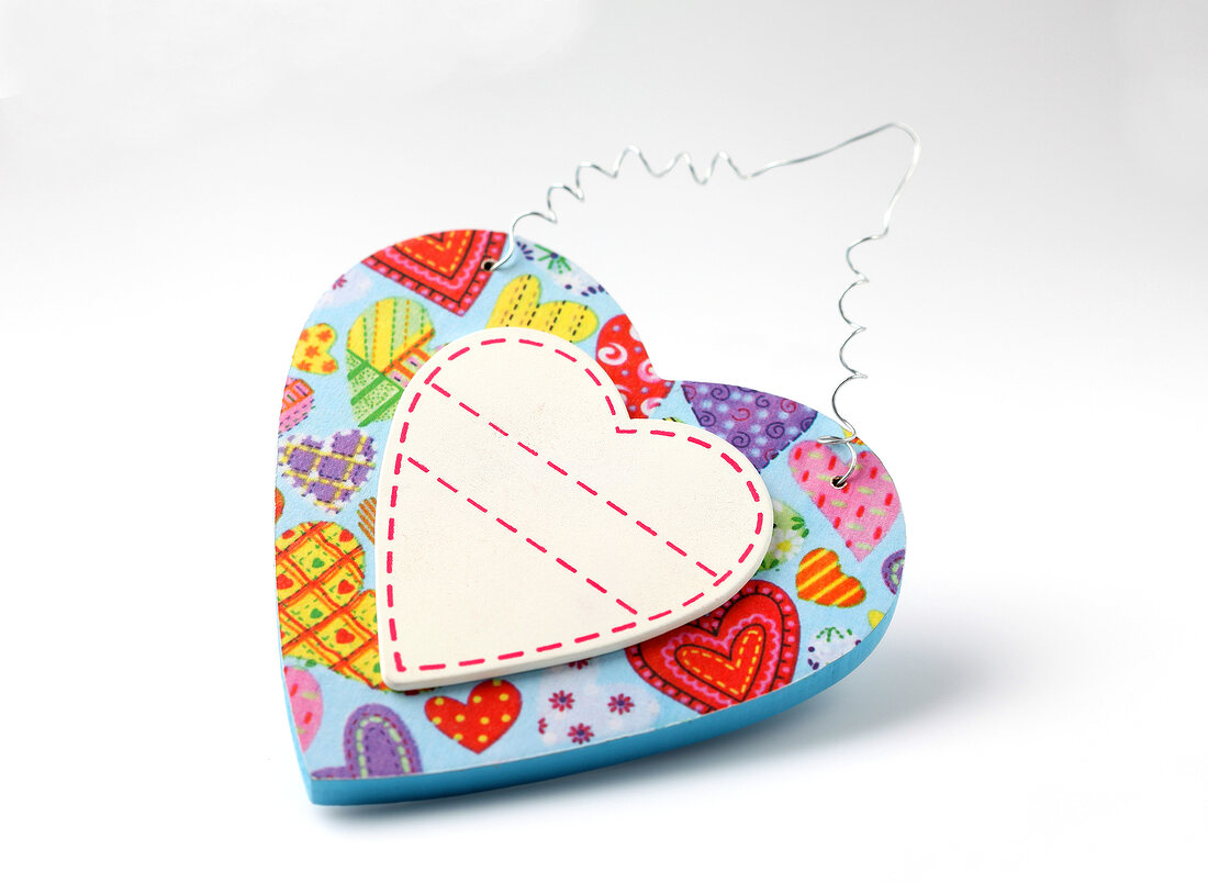 Colourful heart with heart motif on white background