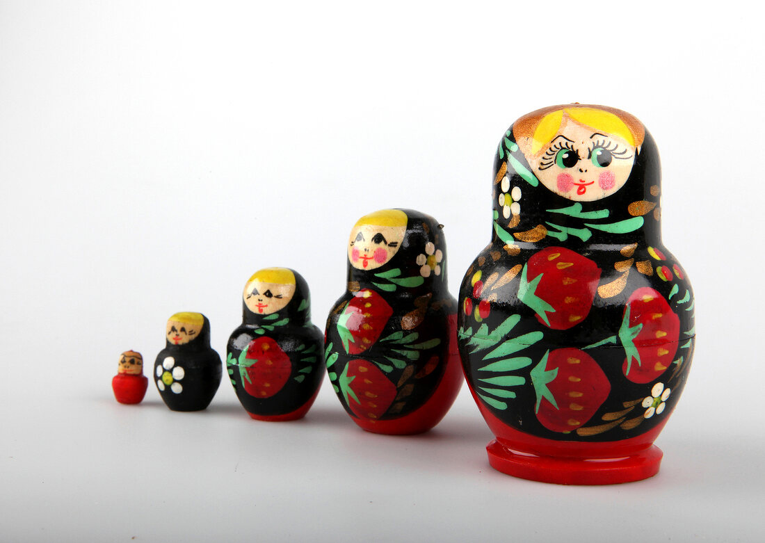 Colourful Russian dolls on white background