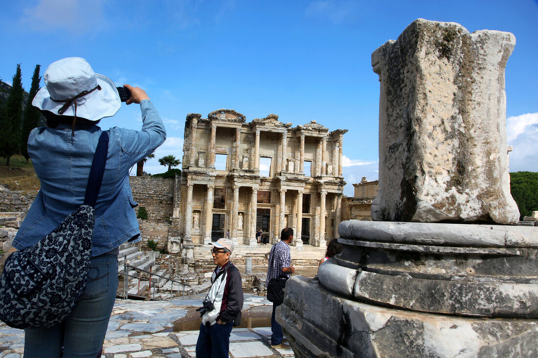 Vacationers clicking photos of library of ancient Ephesus, Aegean, Turkey