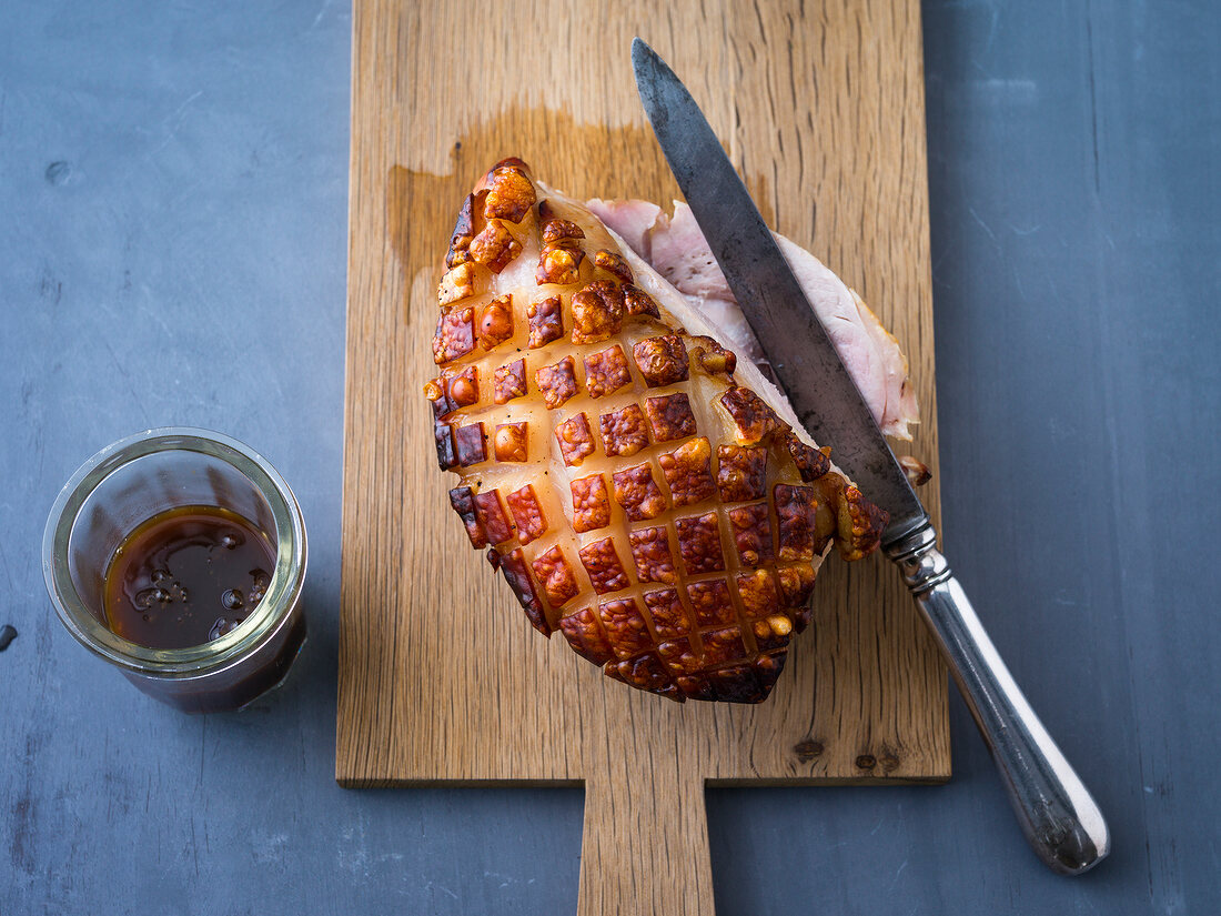 Baked ham on cutting board