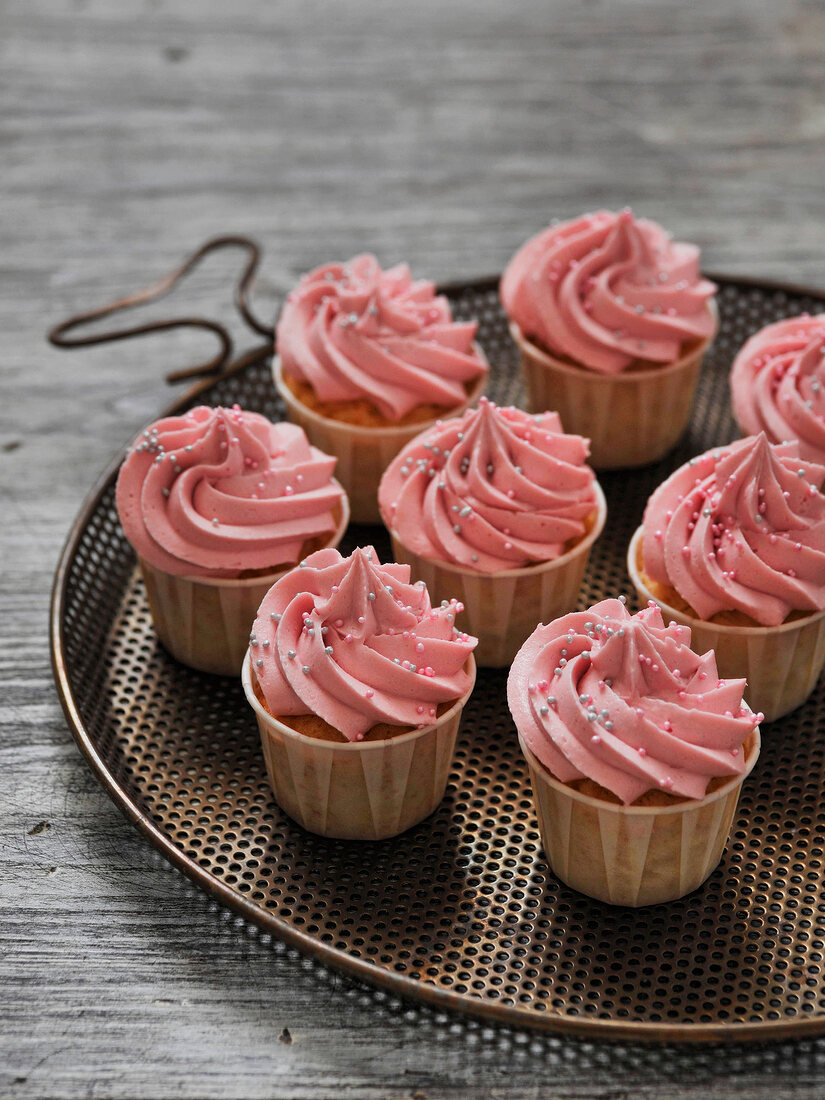 Passion fruit cupcakes on tray